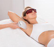 woman receiving laser hair removal in her armpits at Adavanced Rejuvenation Center.