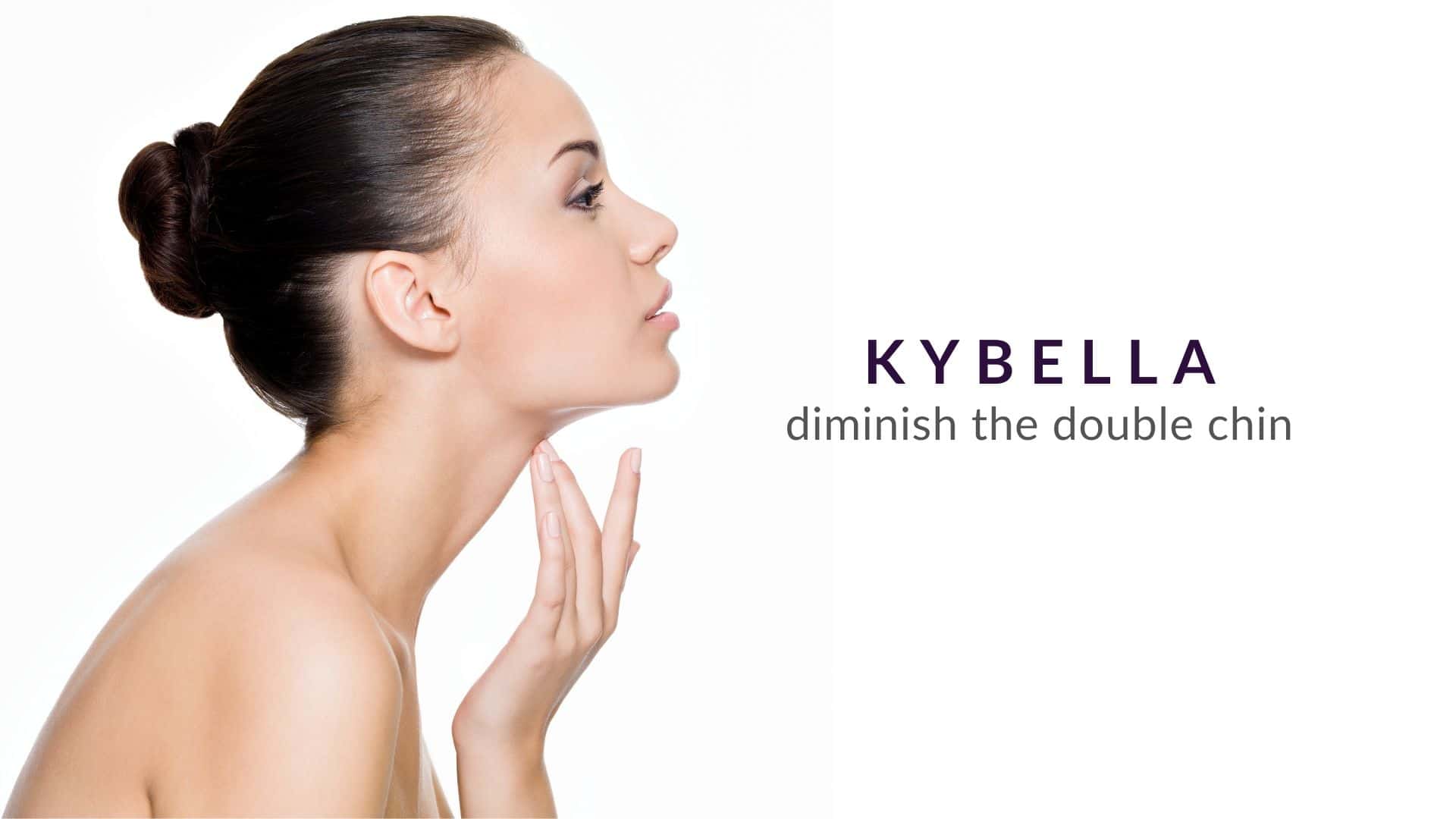 Woman touching her defined chin after kybella treatment at advanced rejuvenation centers.