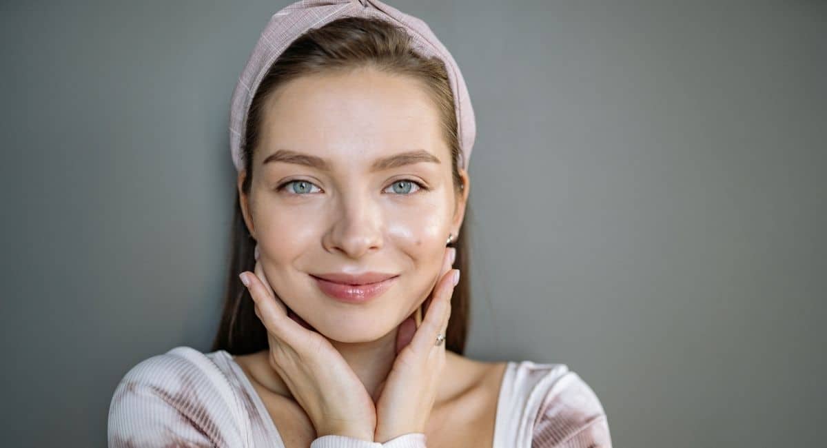 beautiful woman touching her face